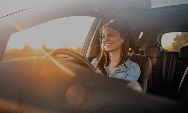 A woman driving a car.